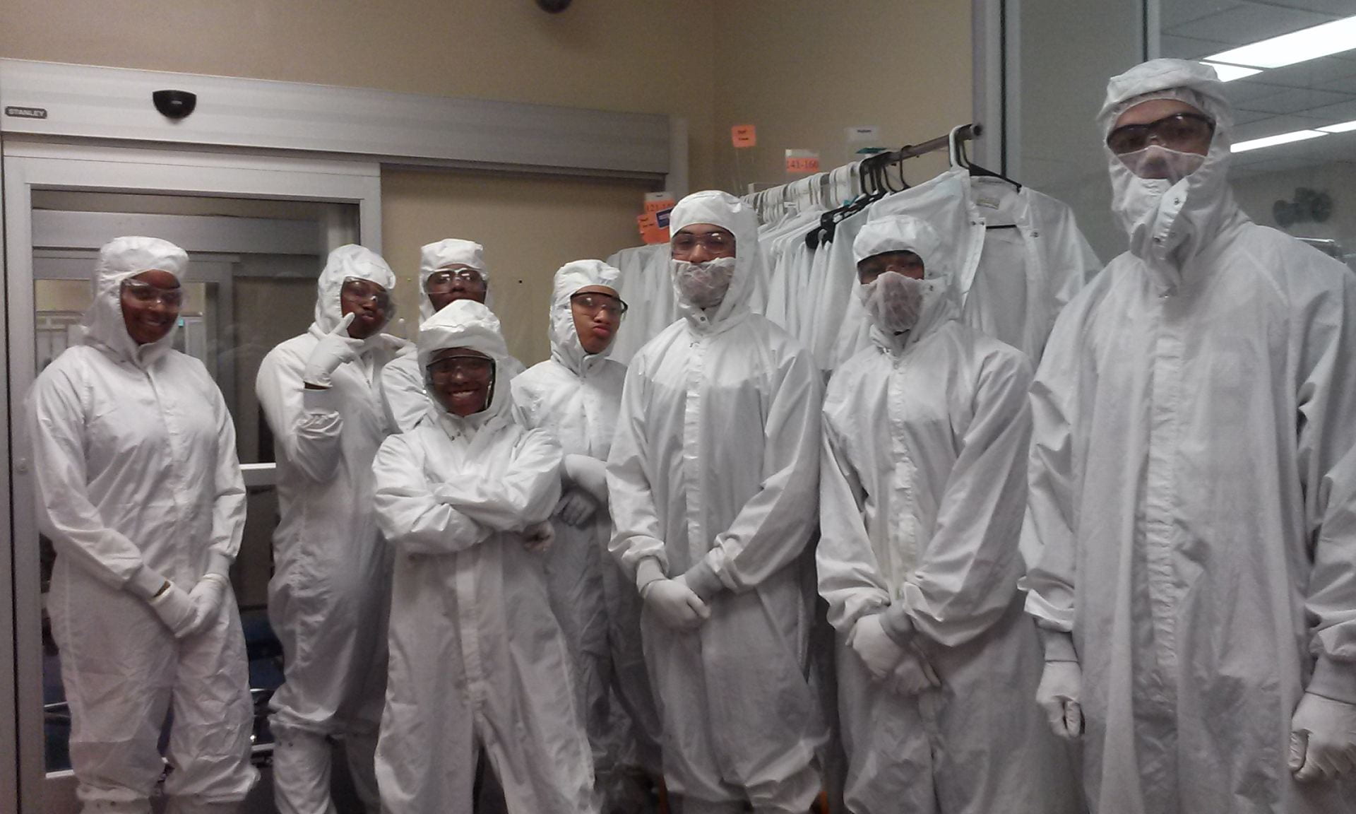 High school students in wearing cleanroom gowns